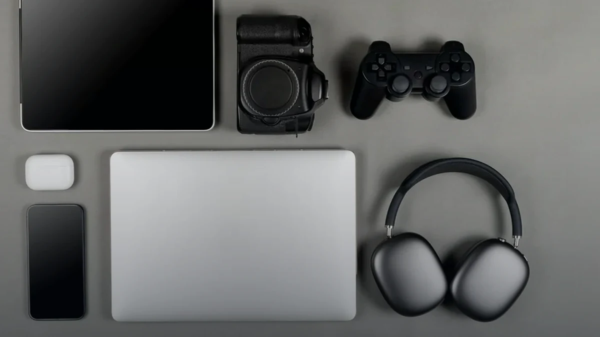 Camera, phone and creator equipment arranged on a desk